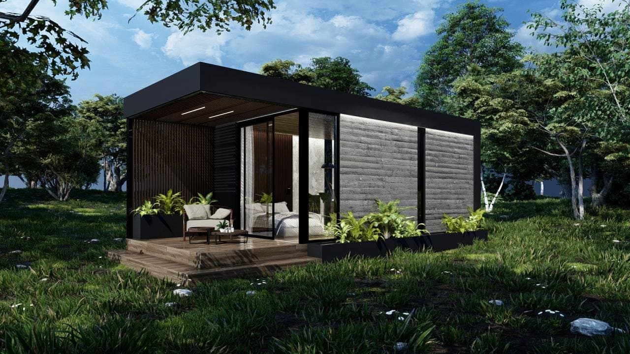 Módulo Urbano, exterior negro con deck de madera en el bosque